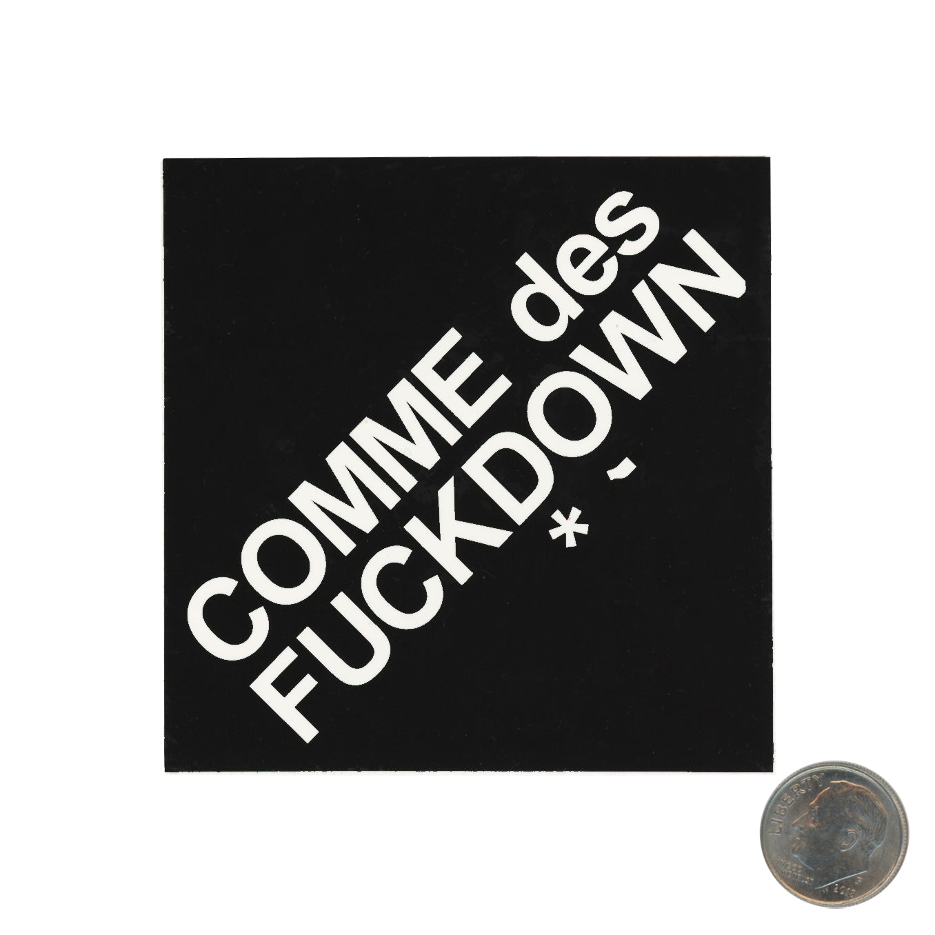 COMME des FUCKDOWN Logo Sticker with dime